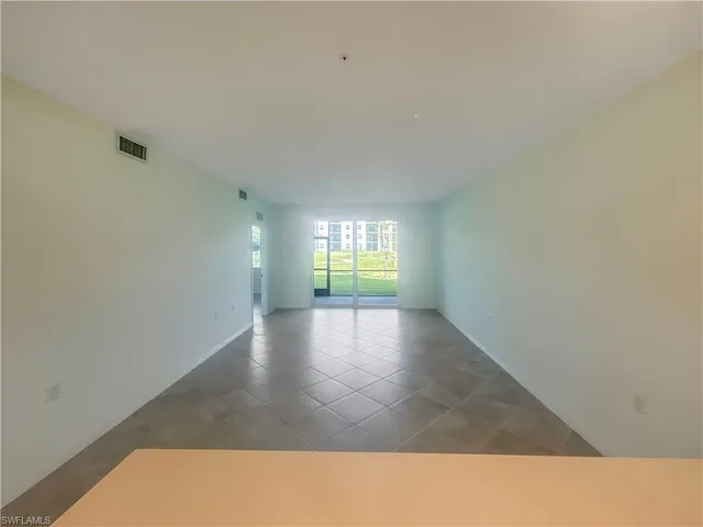 a view of an empty room and window