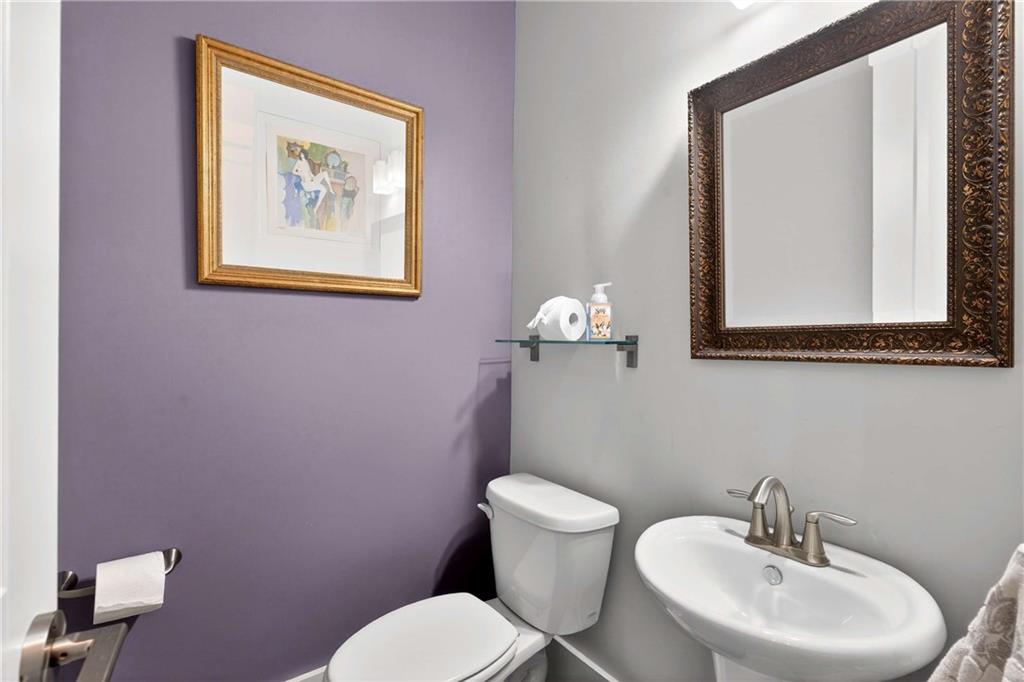 208 Sessions Street Woodstock, GA 30188 - Photo 20 of 47 a bathroom with a toilet a sink and mirror