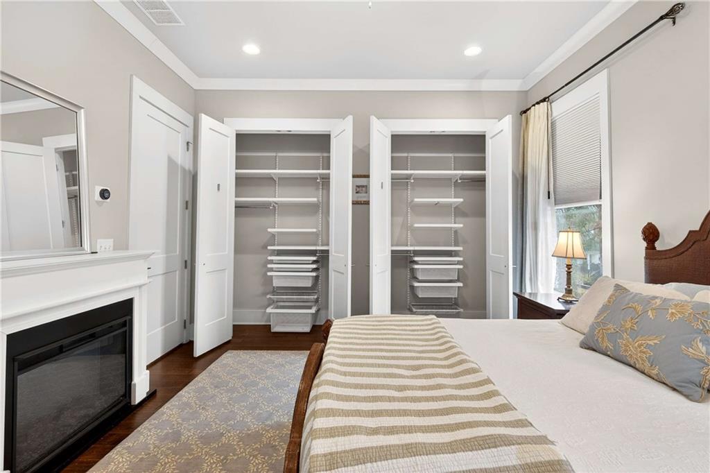 208 Sessions Street Woodstock, GA 30188 - Photo 25 of 47 a bedroom with a bed and a fireplace