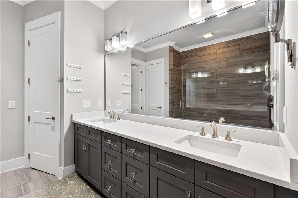 208 Sessions Street Woodstock, GA 30188 - Photo 26 of 47 a bathroom with a sink double vanity and a shower