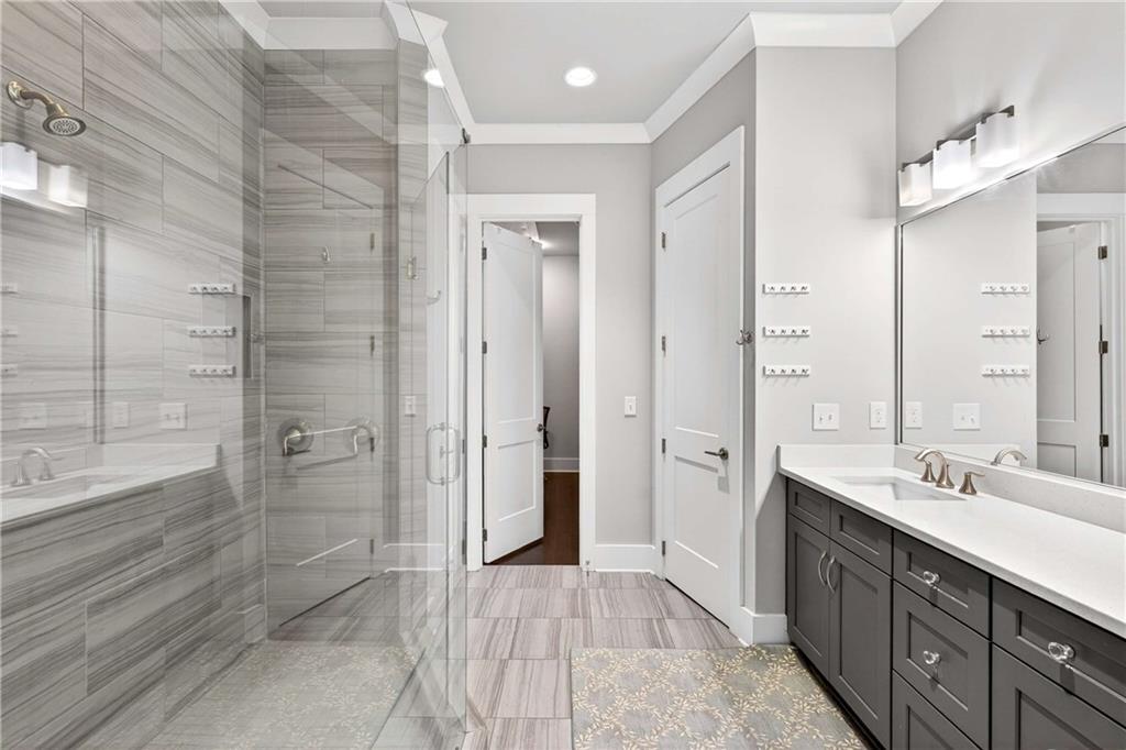 208 Sessions Street Woodstock, GA 30188 - Photo 27 of 47 a spacious bathroom with a shower sink and mirror