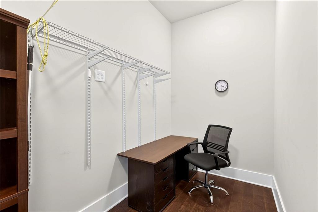 208 Sessions Street Woodstock, GA 30188 - Photo 28 of 47 a view of workspace with wooden floor and chair