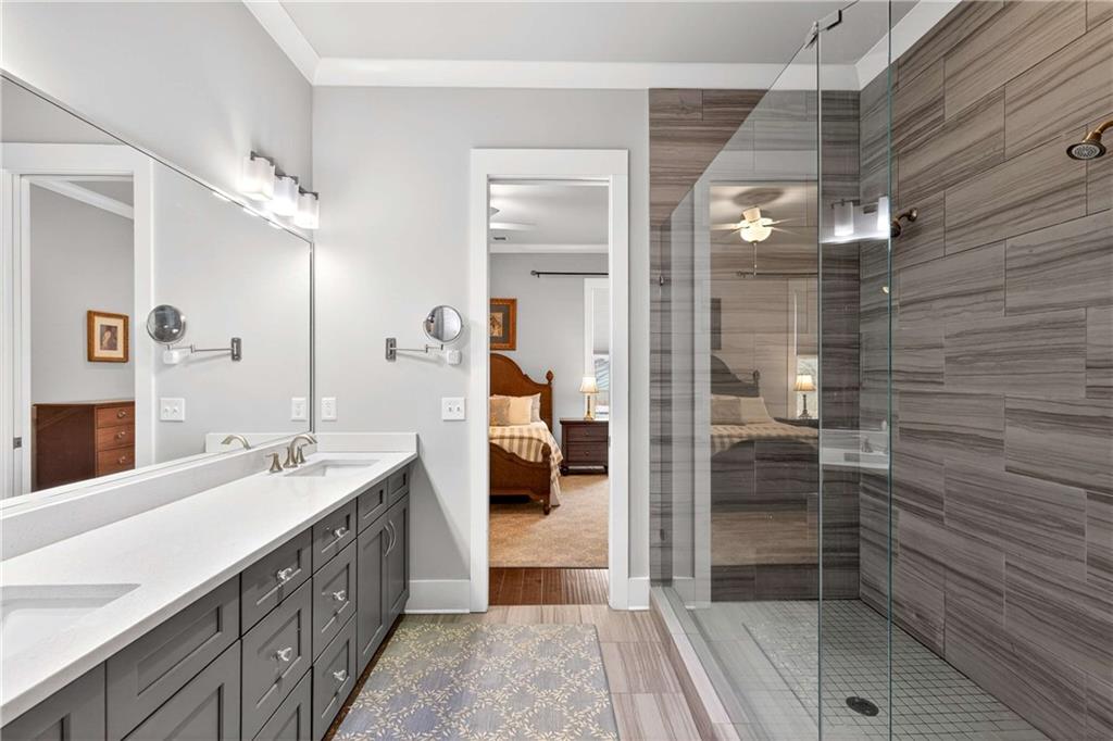 208 Sessions Street Woodstock, GA 30188 - Photo 29 of 47 a bathroom with a double vanity sink and a mirror