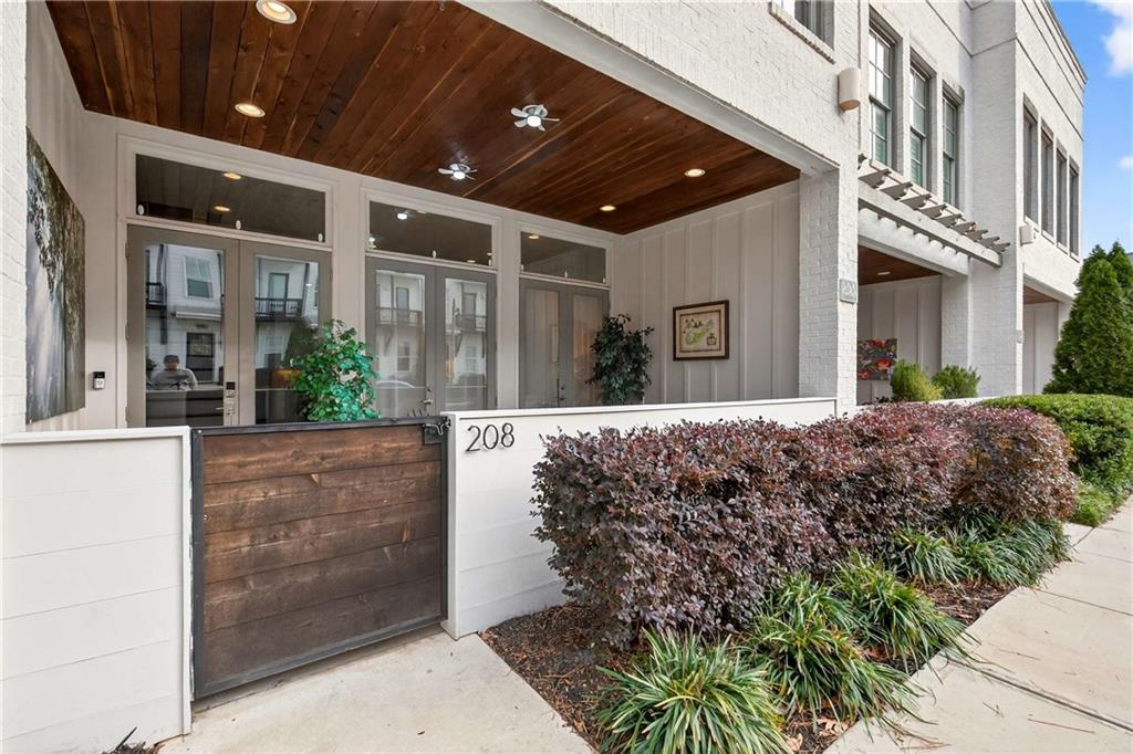 208 Sessions Street Woodstock, GA 30188 - Photo 3 of 47 a view of a house with a garden