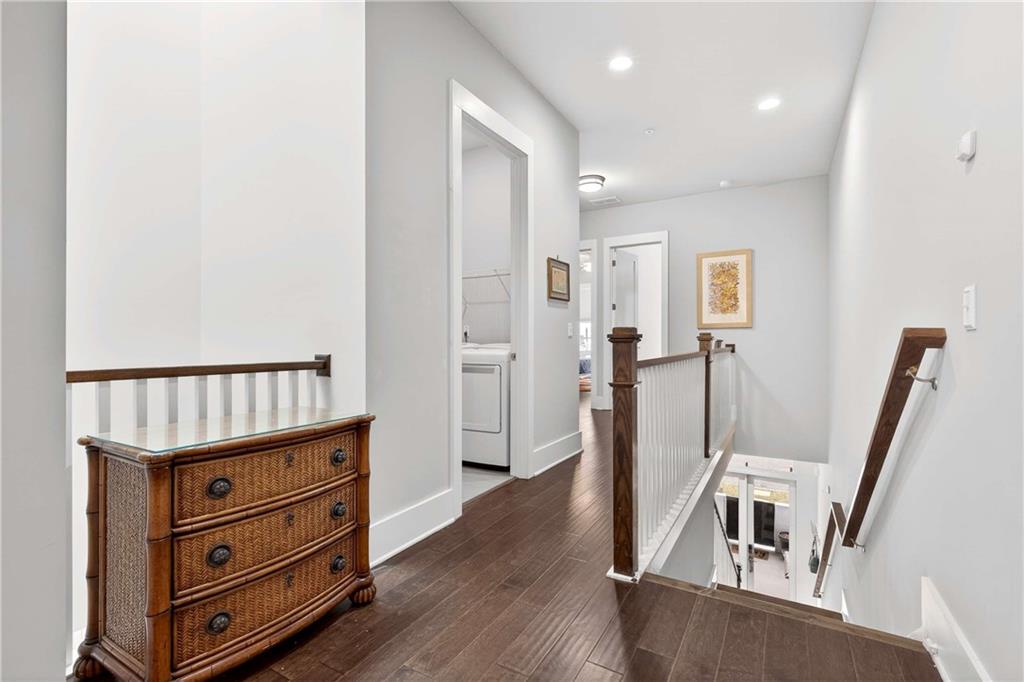 208 Sessions Street Woodstock, GA 30188 - Photo 31 of 47 a view of hallway with a window and wooden floor