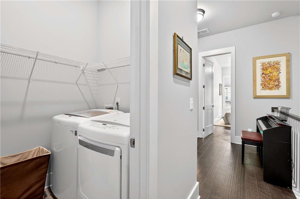 208 Sessions Street Woodstock, GA 30188 - Photo 32 of 47 a view of a storage & utility room with closet wooden floor