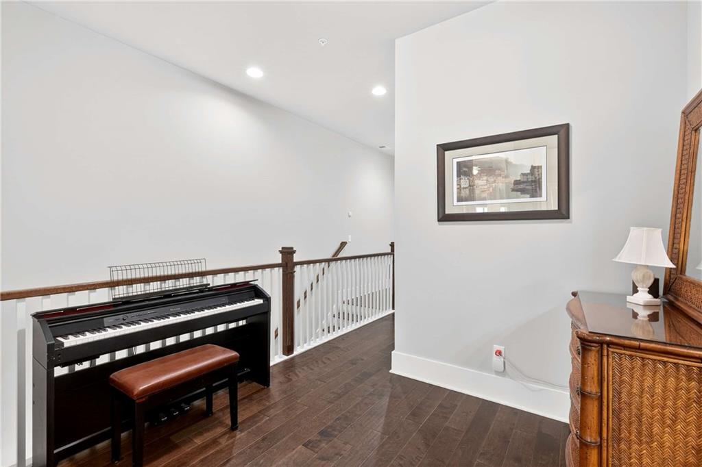 208 Sessions Street Woodstock, GA 30188 - Photo 33 of 47 a view of an empty room with wooden floor