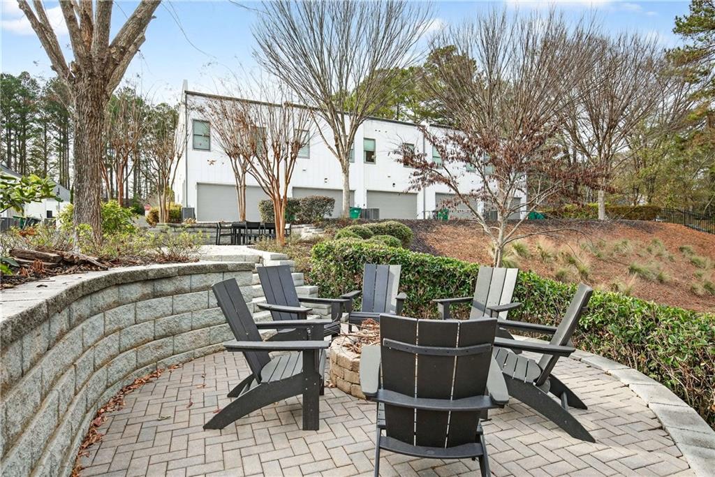 208 Sessions Street Woodstock, GA 30188 - Photo 43 of 47 a view of backyard with outdoor seating and trees