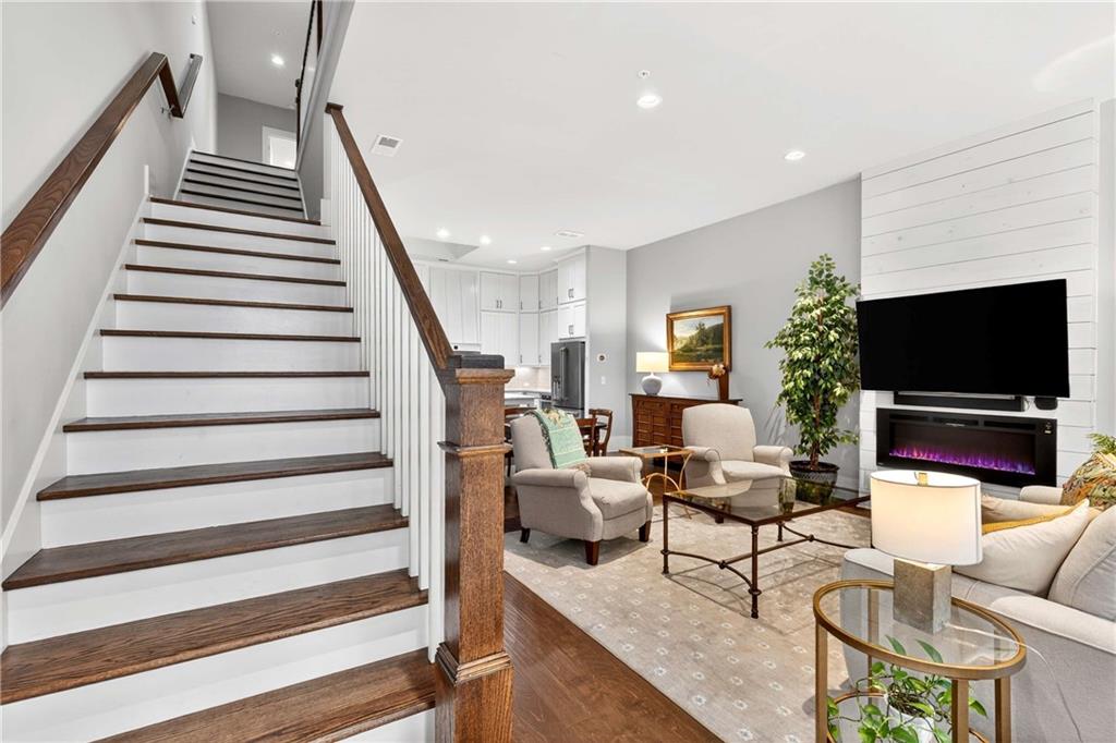 208 Sessions Street Woodstock, GA 30188 - Photo 8 of 47 a living room with furniture and a flat screen tv