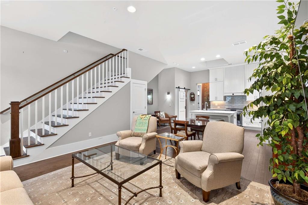 208 Sessions Street Woodstock, GA 30188 - Photo 9 of 47 a living room with furniture and a potted plant