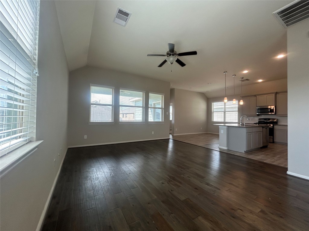 3132 Dunsmore Manor Court Spring, TX 77386 - Photo 14 of 18 a view of empty room with wooden floor and windows