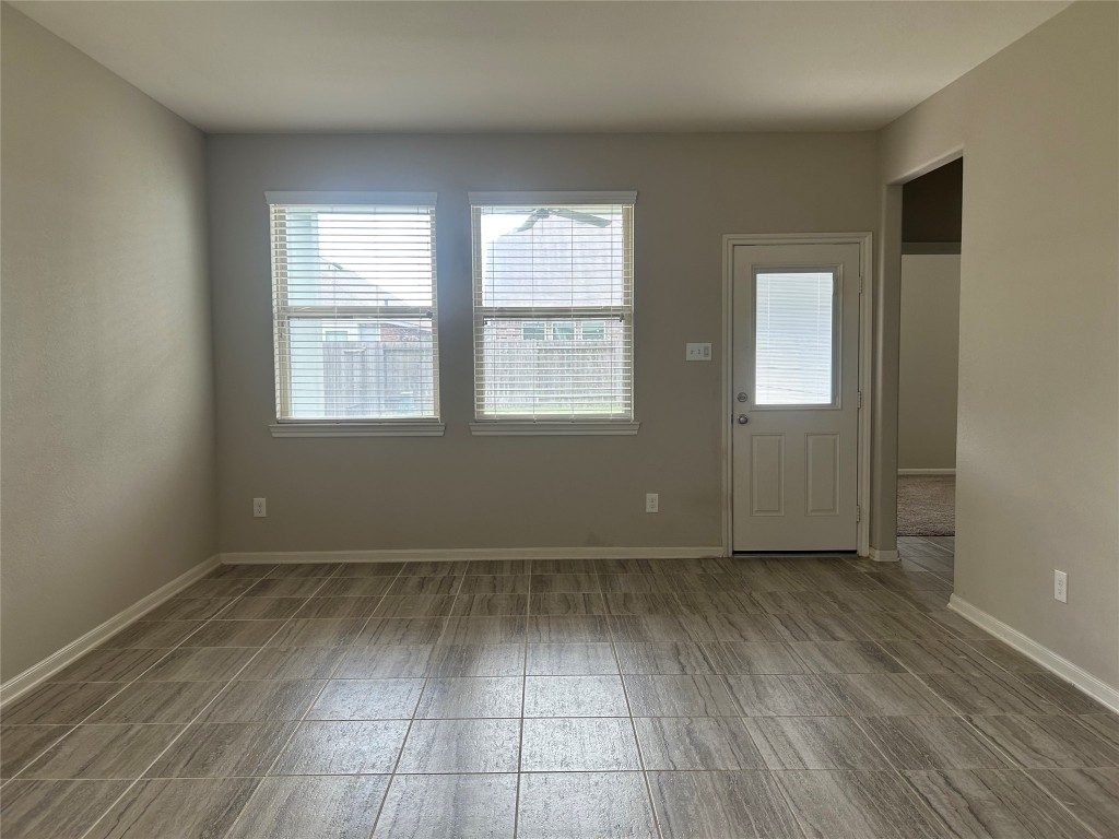 3132 Dunsmore Manor Court Spring, TX 77386 - Photo 18 of 18 an empty room with wooden floor and windows