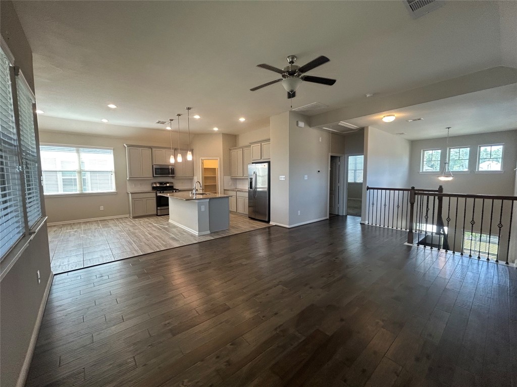 3132 Dunsmore Manor Court Spring, TX 77386 - Photo 4 of 18 a view of a kitchen with a sink and a stove top oven
