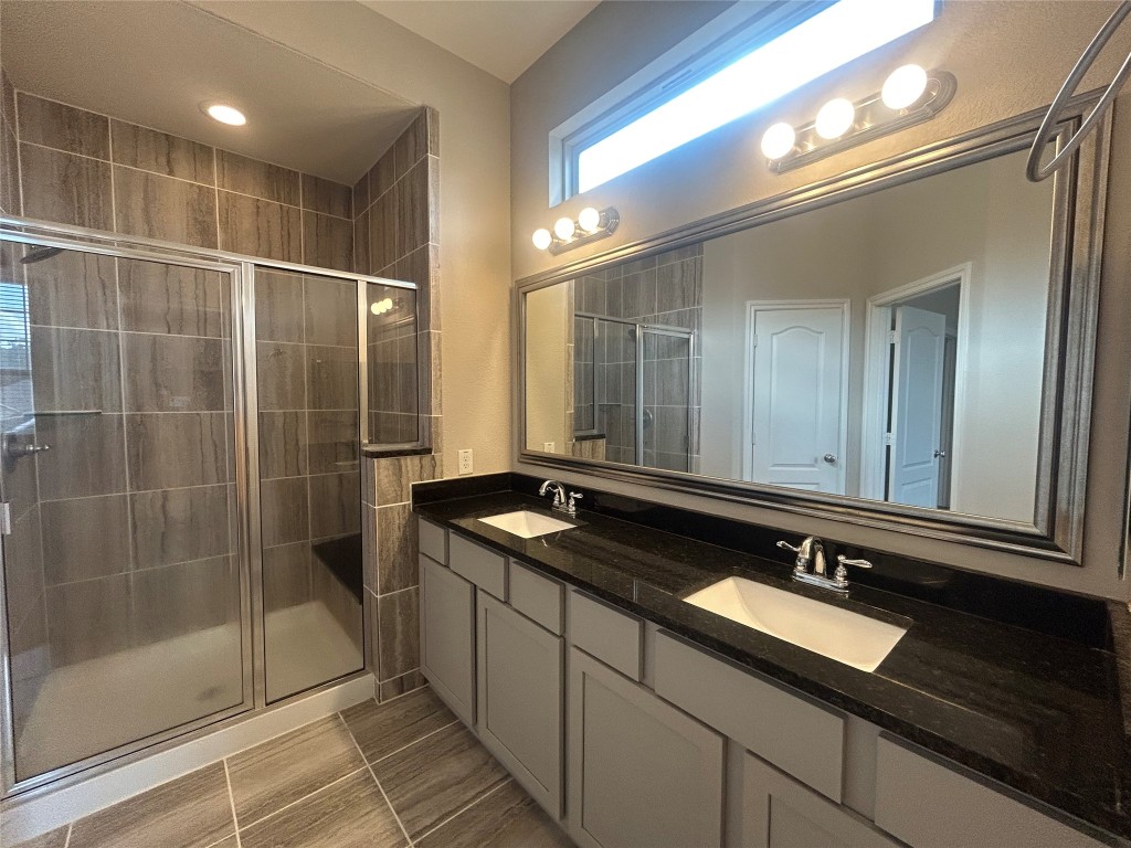 3132 Dunsmore Manor Court Spring, TX 77386 - Photo 9 of 18 a bathroom with a sink and a mirror