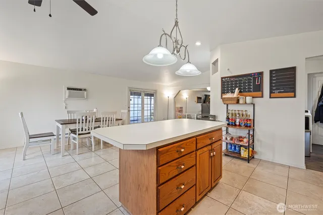 a kitchen that has a lot of cabinets in it
