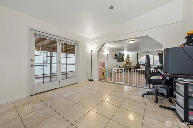 a view of a livingroom with furniture and a window