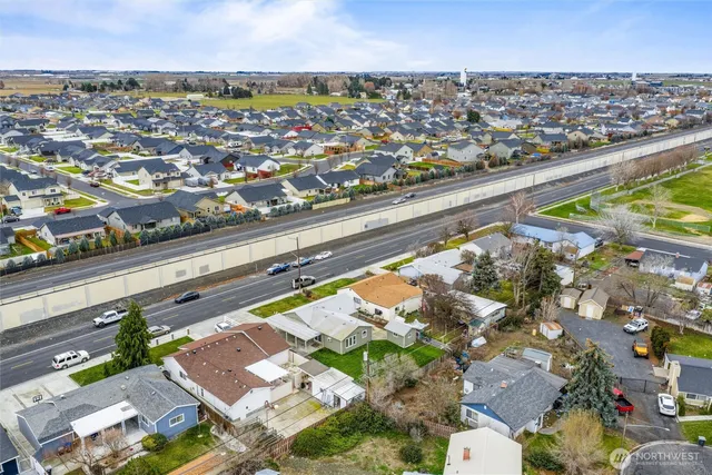 an aerial view of a house with a yard