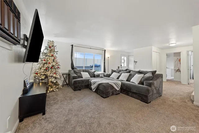 a living room with furniture and a flat screen tv