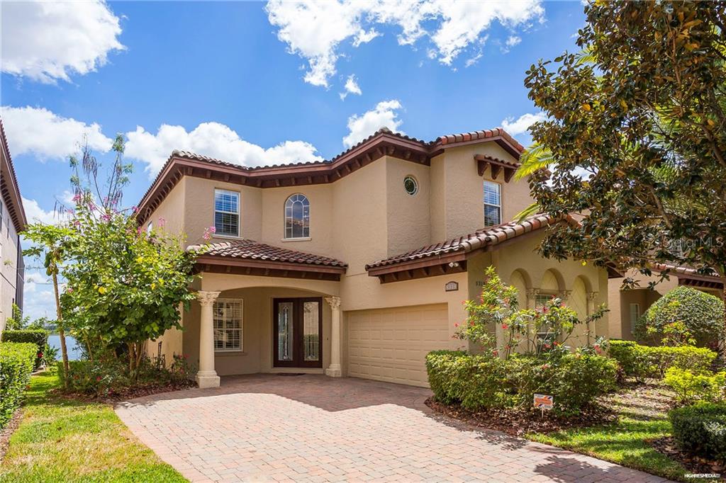 8319 Vía Rosa Orlando, FL 32836 - Photo 1 of 1 a front view of a house with a garden