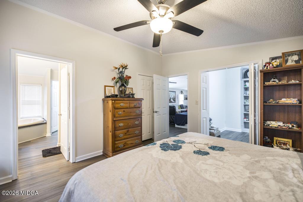 319 Pope Road Roberta, GA 31078 - Photo 18 of 42 a bedroom with a bed and a chandelier