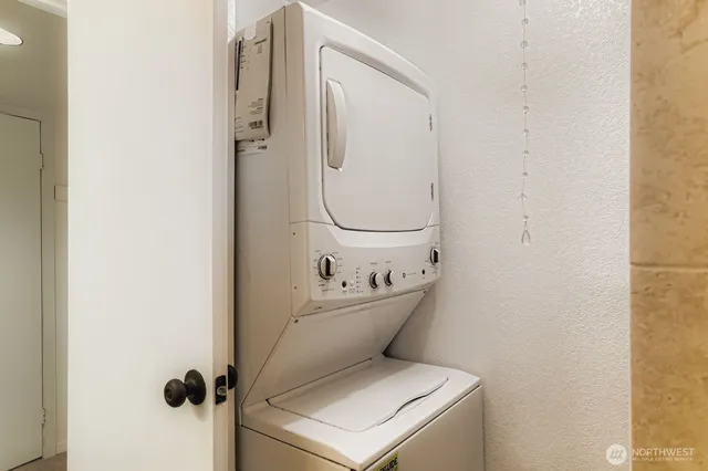 a bathroom with a sink mirror and toilet