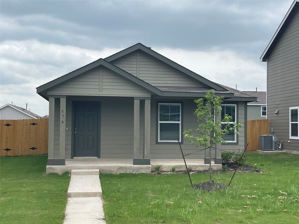 576 Avre Loop Kyle, TX 78640 - Photo 1 of 11 front view of a house with a yard