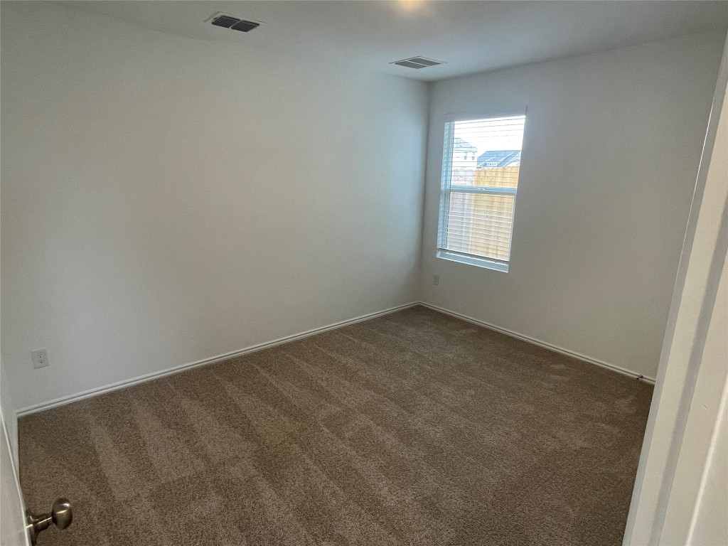 576 Avre Loop Kyle, TX 78640 - Photo 6 of 11 an empty room with a window