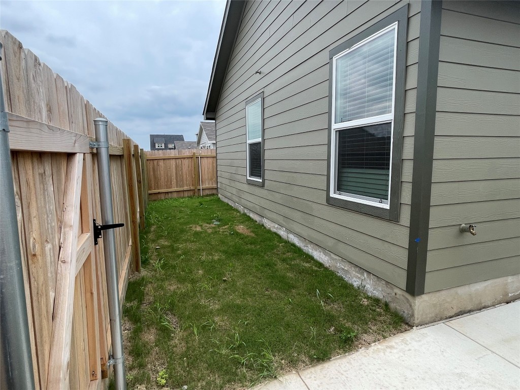 576 Avre Loop Kyle, TX 78640 - Photo 10 of 11 a view of a backyard