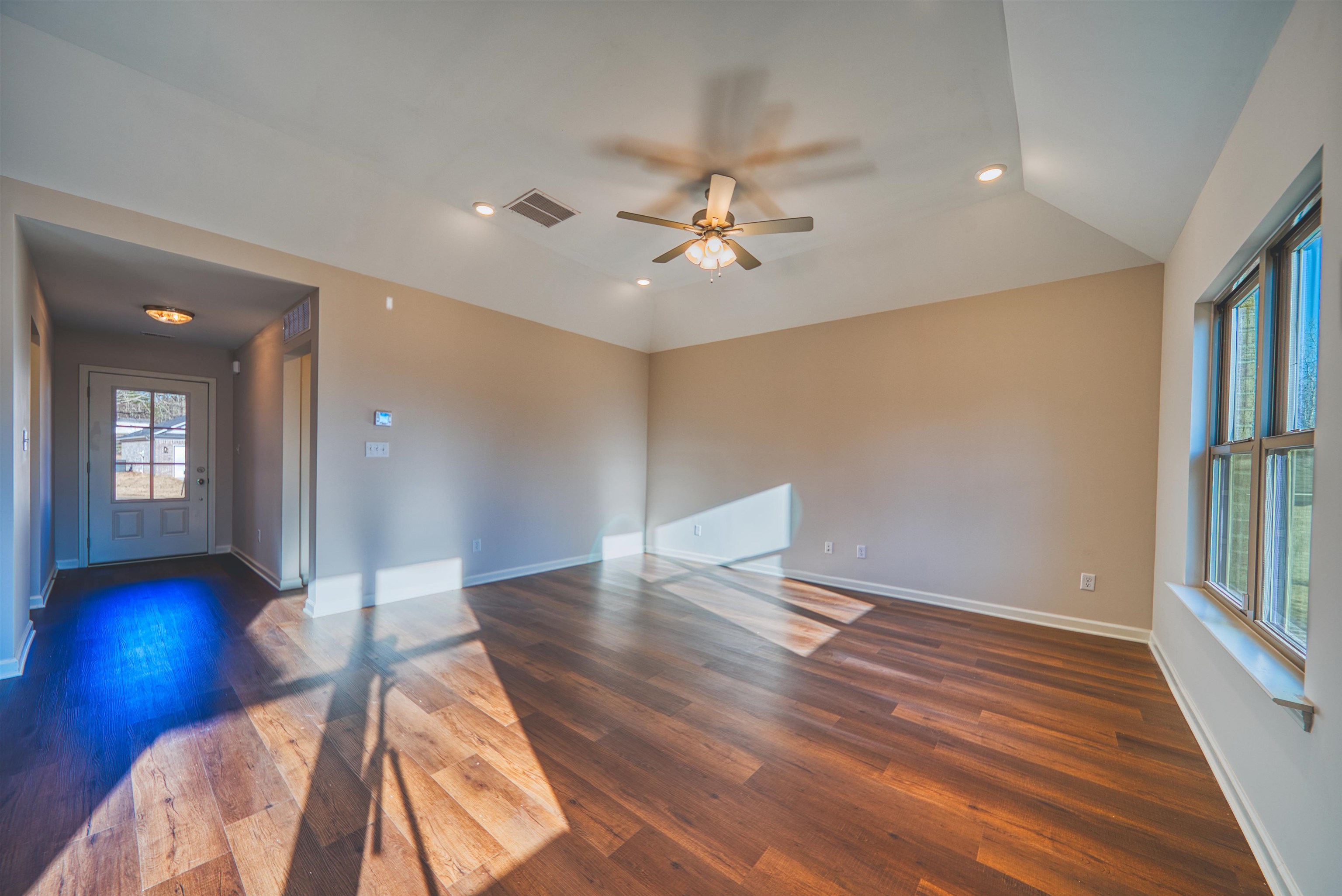 103 Stone Brook Cove Ripley, TN 38063 - Photo 22 of 34 Unfurnished room featuring recessed lighting, dark wood finished floors, a ceiling fan, and vaulted ceiling