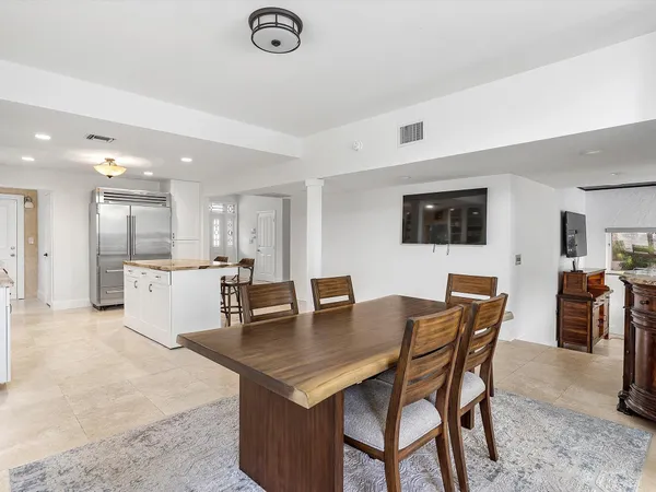 a kitchen with stainless steel appliances granite countertop a sink and cabinets