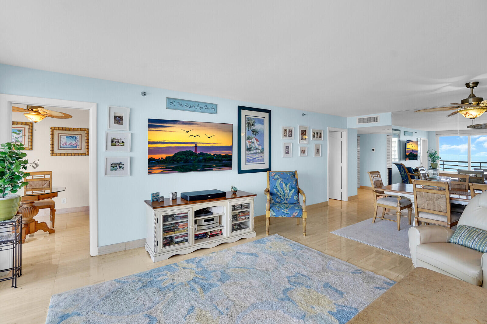 4101 North Ocean Boulevard, Unit 1604 Boca Raton, FL 33431 - Photo 20 of 51 a living room with furniture and a flat screen tv