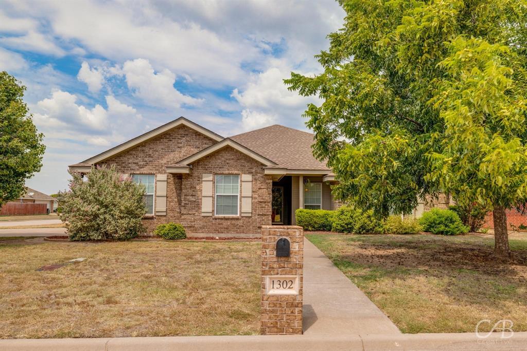 1302 Lewis And Clark Trail Abilene, TX 79602 - Photo 1 of 37 a front view of house with yard and trees around