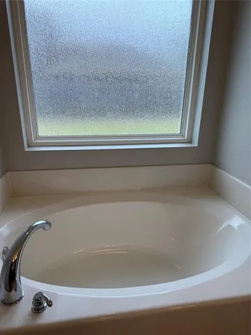 a bathroom with bathtub