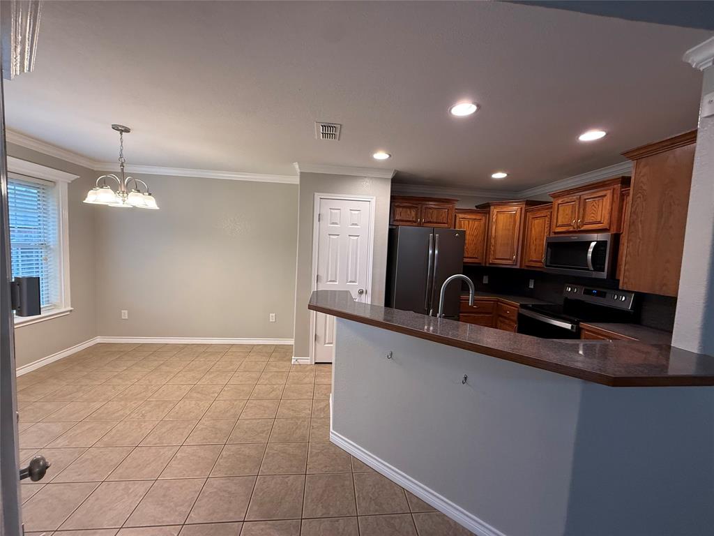 1302 Lewis And Clark Trail Abilene, TX 79602 - Photo 17 of 37 a view of kitchen with stainless steel appliances granite countertop a sink and a counter top space