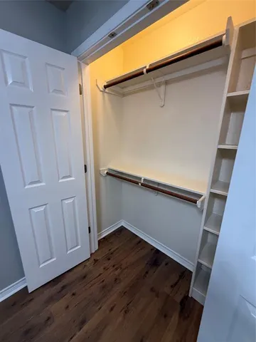 a view of an empty room with a sliding door