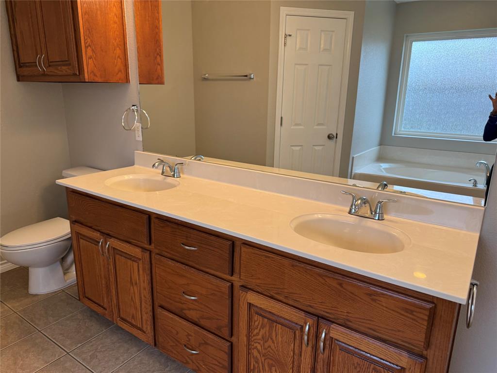 1302 Lewis And Clark Trail Abilene, TX 79602 - Photo 8 of 37 a bathroom with a sink and a toilet