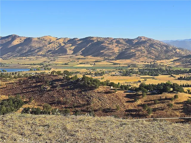 a kitchen with kitchen island a stove and a refrigerator