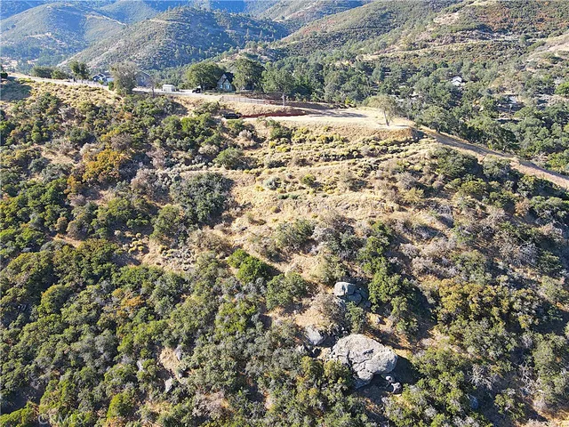 an aerial view of residential house and green space