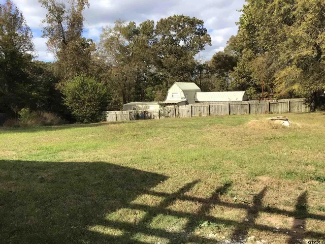 a view of a lake with a yard