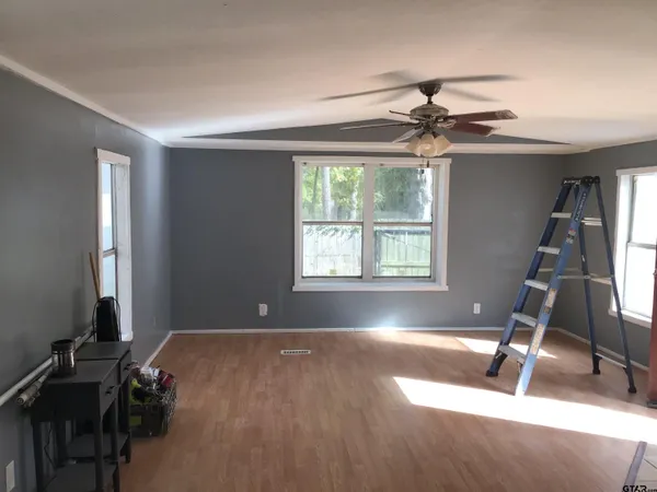 a room with gym equipment and a window