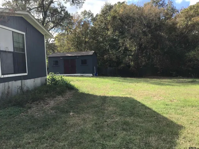 a view of a swimming pool with an outdoor space