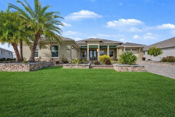 a front view of house with yard and green space