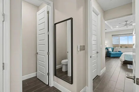 a hall way with a furniture and entryway to a livingroom