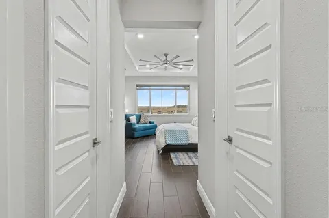 a view of a hallway and a livingroom with a furniture