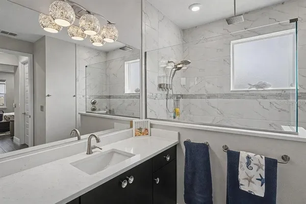 a bathroom with a sink double vanity and a mirror