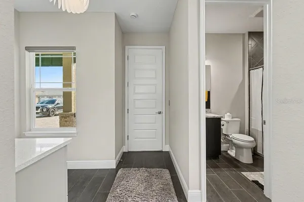 a bathroom with a toilet and a shower