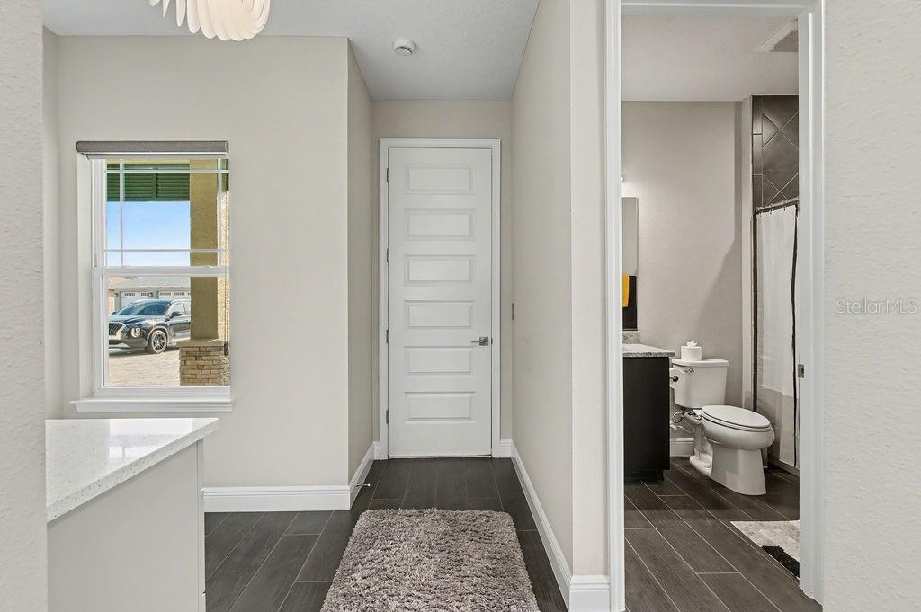 9963 Southwest 82nd Street Road Ocala, FL 34481 - Photo 27 of 43 a bathroom with a toilet and a shower