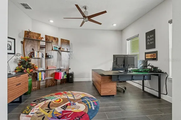 a view of a workspace with furniture