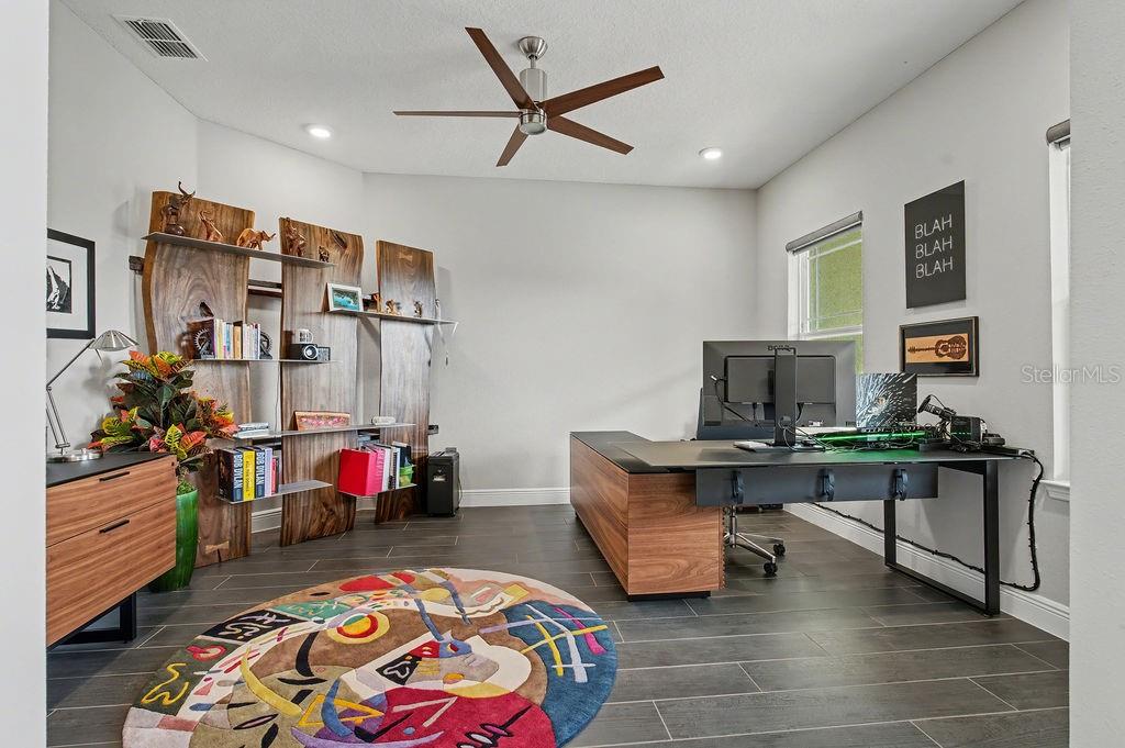 9963 Southwest 82nd Street Road Ocala, FL 34481 - Photo 4 of 43 a view of a workspace with furniture