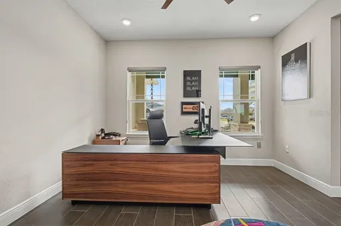 a view of room with window and wooden floor